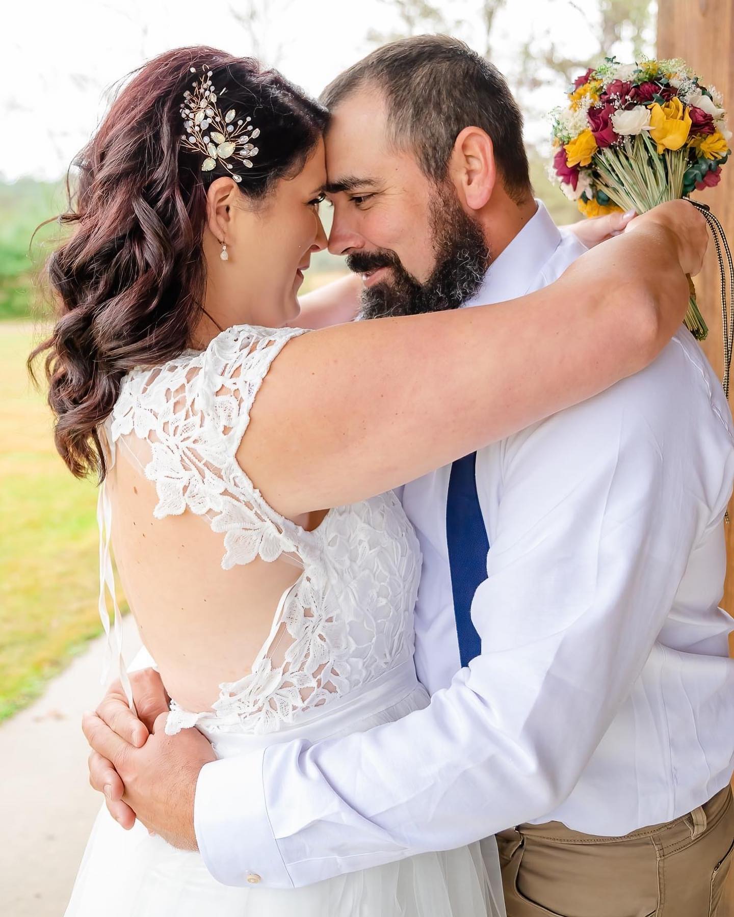 groom and bride embracing